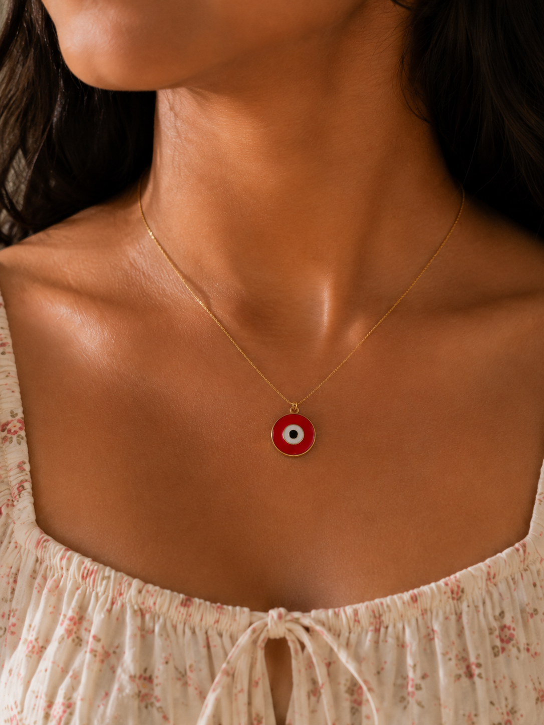 Red enamel evil eye pendant on chain