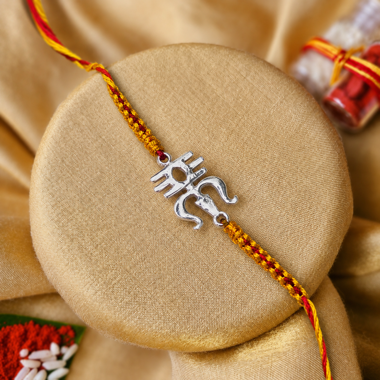 Silver Om saffron thread rakhi