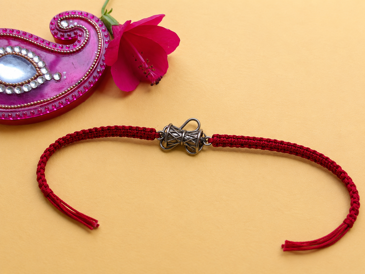 Silver bow red thread rakhi