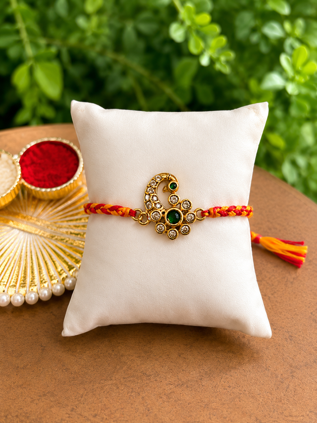 Gold paisley lumba motif rakhi detail