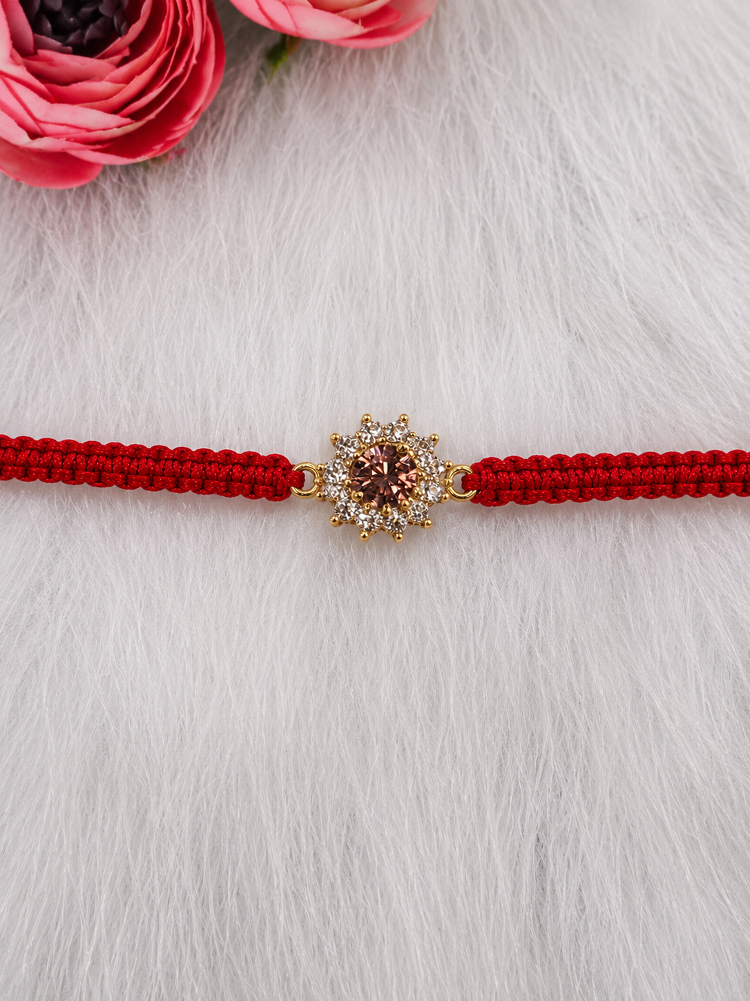Gold pink stone floral motif rakhi detail