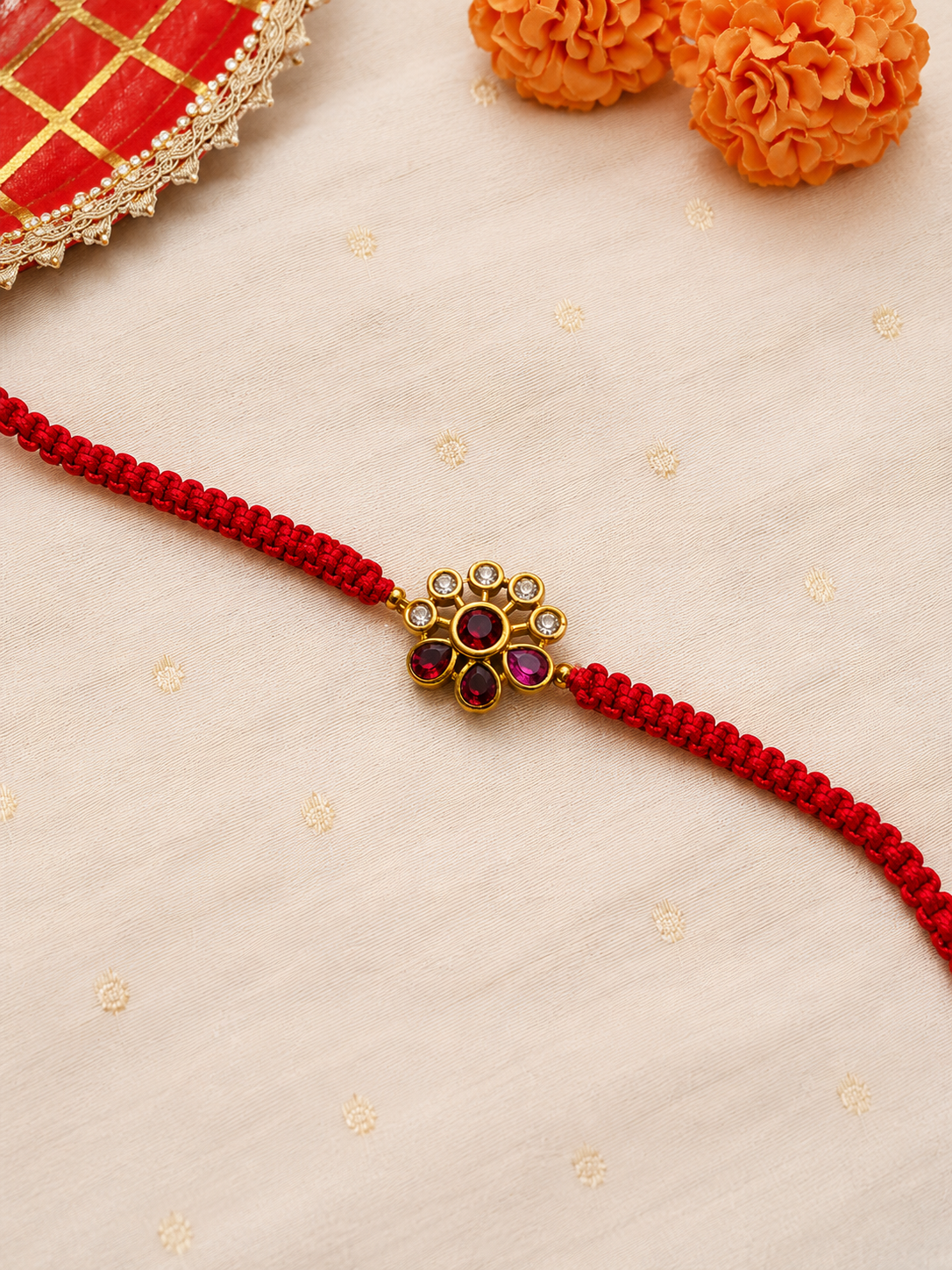 Gold petite floral kundan motif rakhi detail