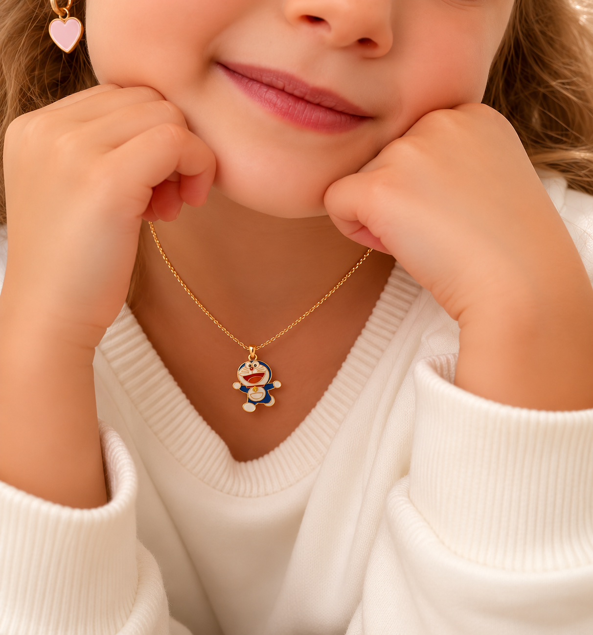 Child wearing the blue enamel character pendant necklace