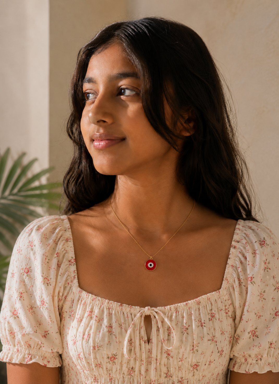 Red enamel evil eye pendant detail