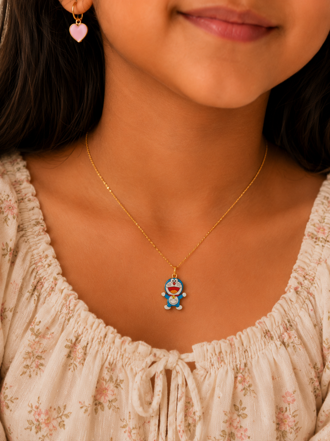 Blue enamel character pendant detail