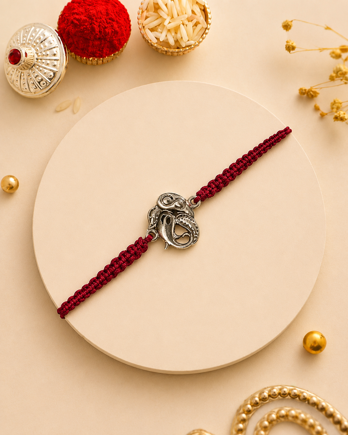 Silver Ganesha red thread rakhi