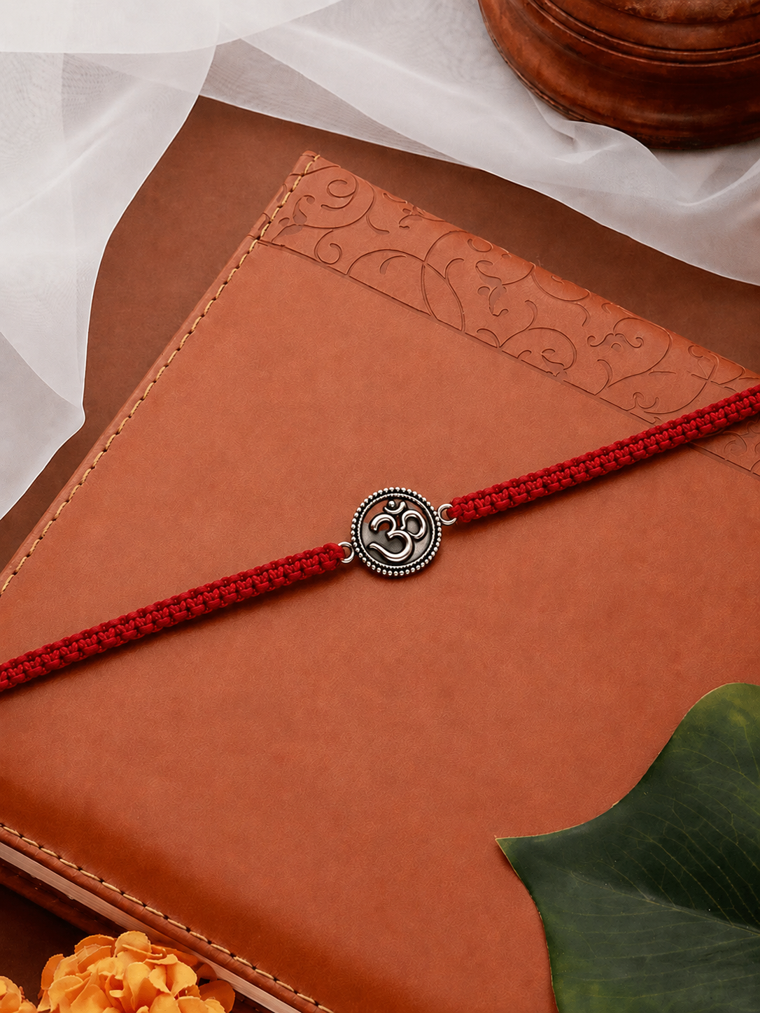 Silver Om disc rakhi detail